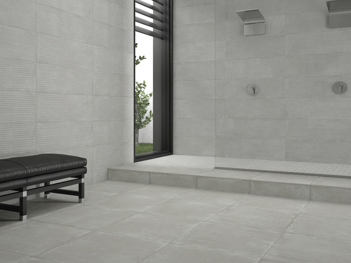 Grijze betonlook vloer- en wandtegels in moderne badkamer